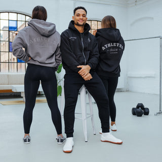 Black Friday campaign Athletes in the Athletes Choice zip hoodie pose in a bright location